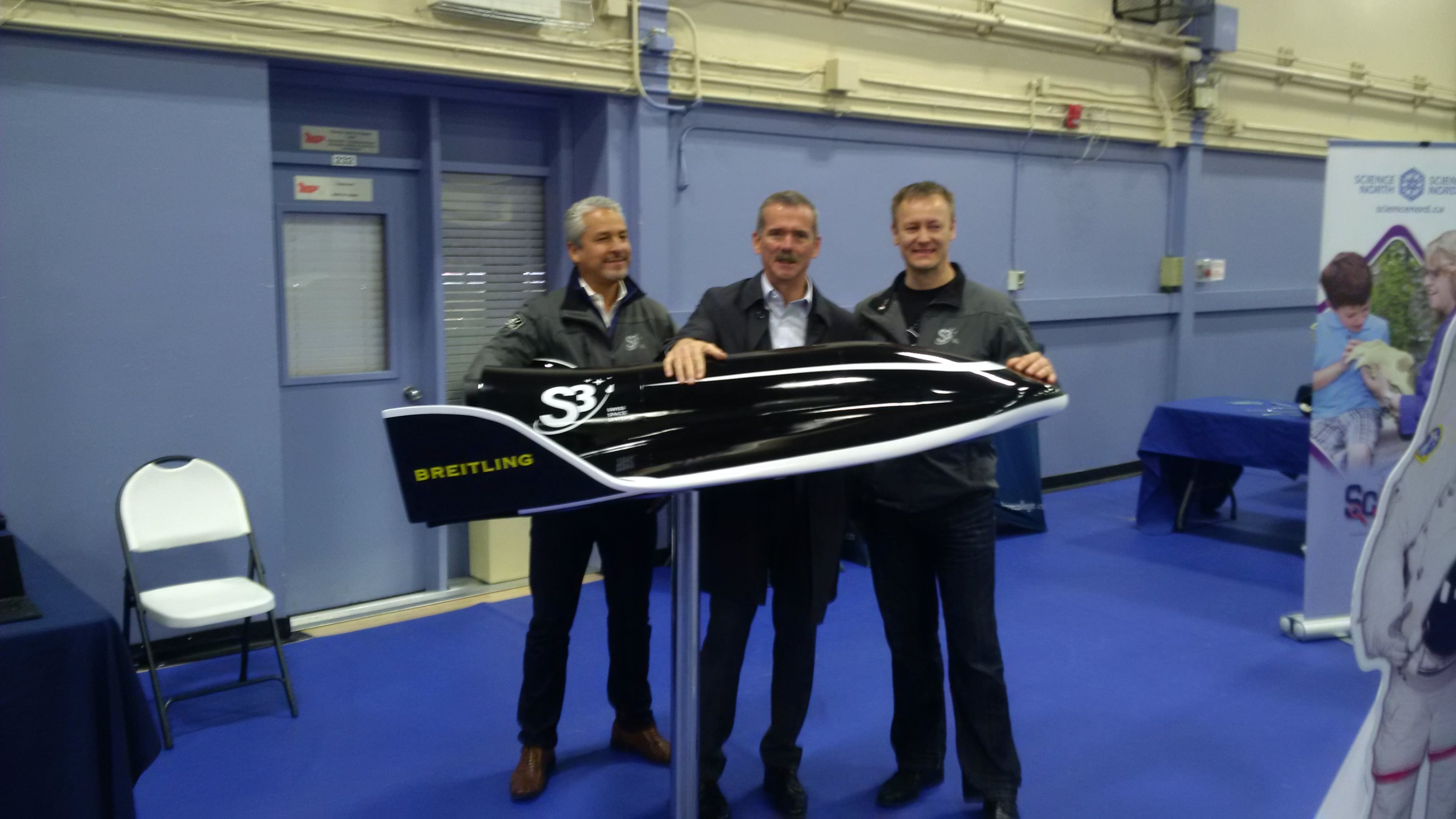 Robert Feierbach and Rolf Brant from Swiss Space Systems with Col. Chris Hadfield and their SOAR shuttle model
